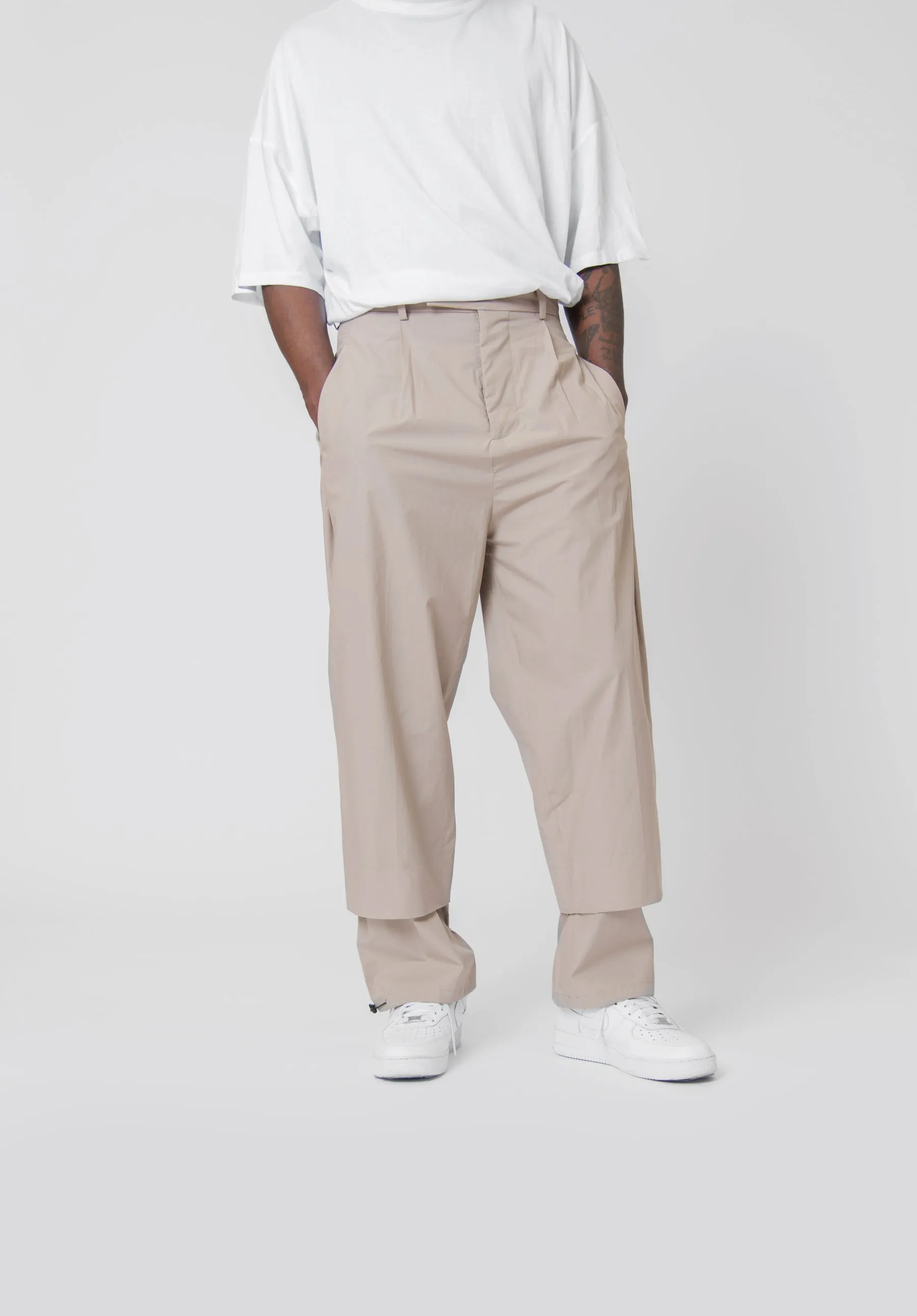 Sure! Here’s an optimized title for the e-commerce product:

Beige Double Hem Trousers for Women – Stylish & Comfortable Casual Pants

Let me know if you need any further assistance!