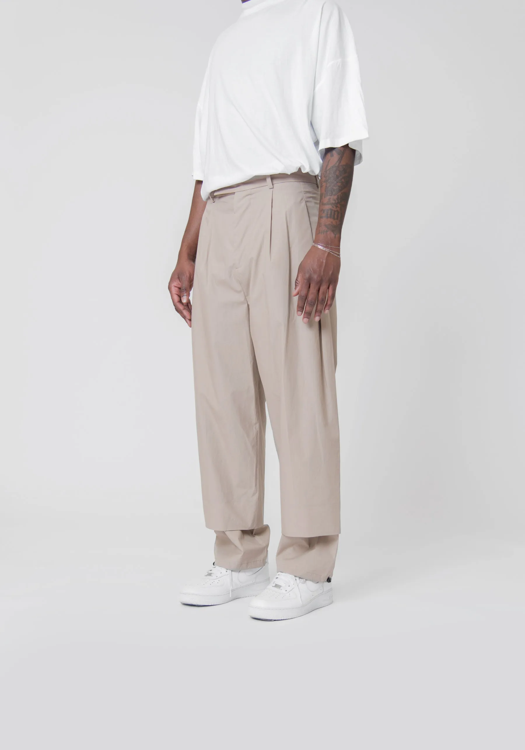 Sure! Here’s an optimized title for the e-commerce product:

Beige Double Hem Trousers for Women – Stylish & Comfortable Casual Pants

Let me know if you need any further assistance!